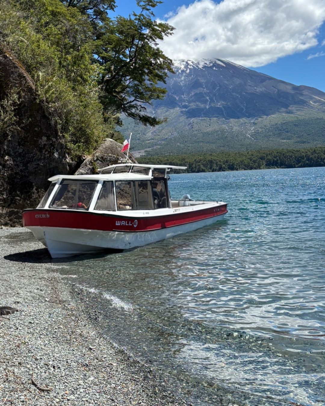 Boat on Todos los Santos lake with Osorno volcano